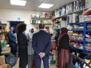 Khadija Coll taking a scottish government minister to meet the local community