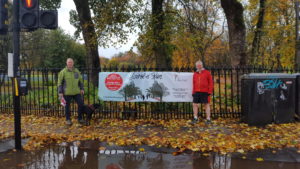 Volunteers with the SVRU standing next to the moira's Run promotional banner